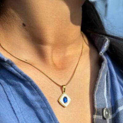 Gold Evil Eye Necklace with Blue Sapphire Accent